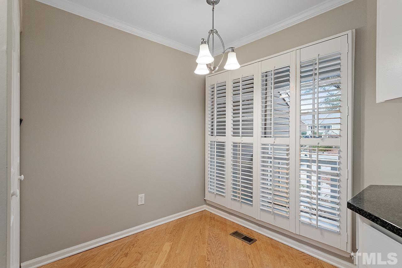 5701 Grasmere Court Raleigh, NC 27609 - Photo 14 of 34 a view of a bedroom with a window