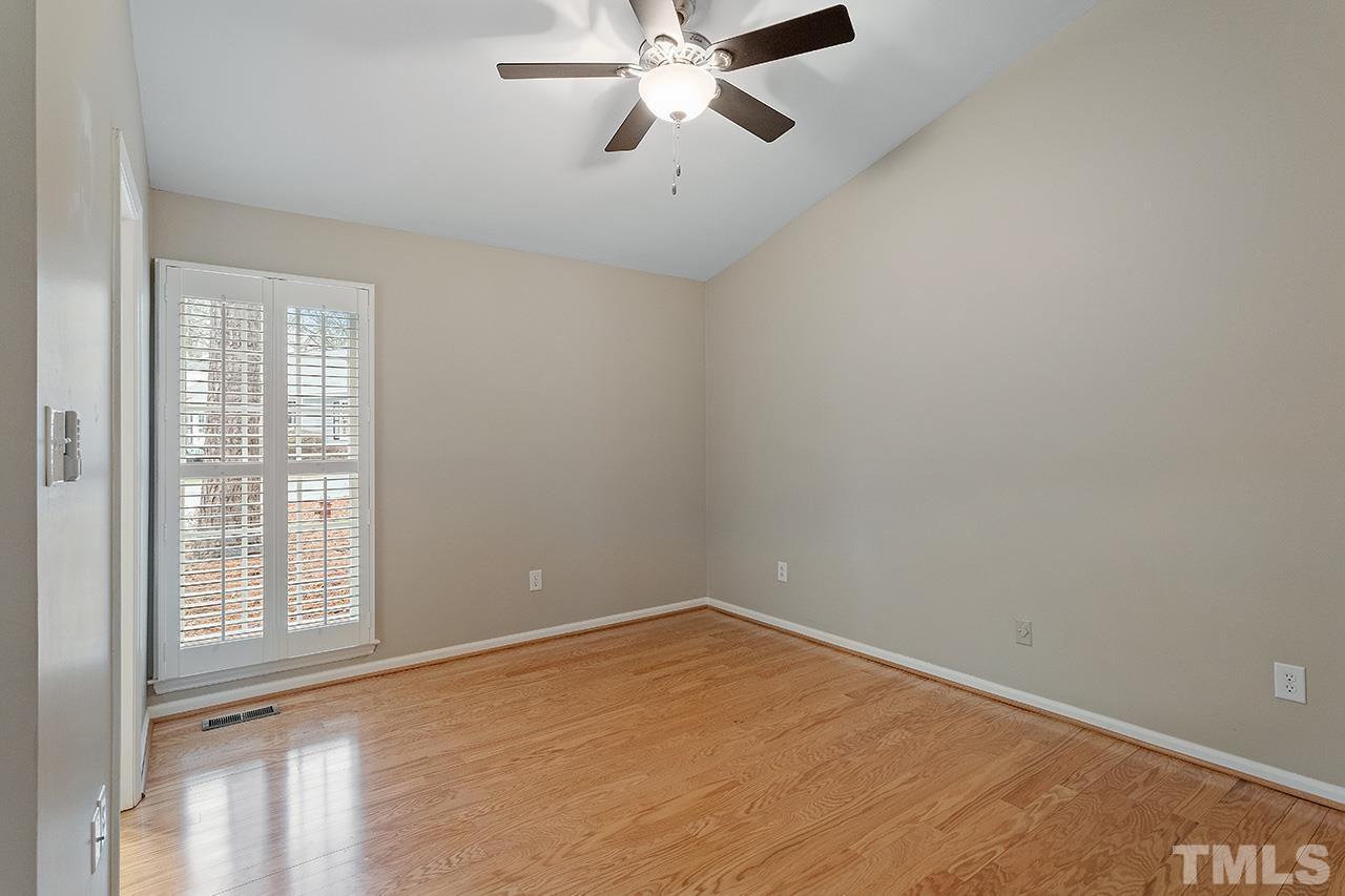 5701 Grasmere Court Raleigh, NC 27609 - Photo 15 of 34 wooden floor in an empty room with a window