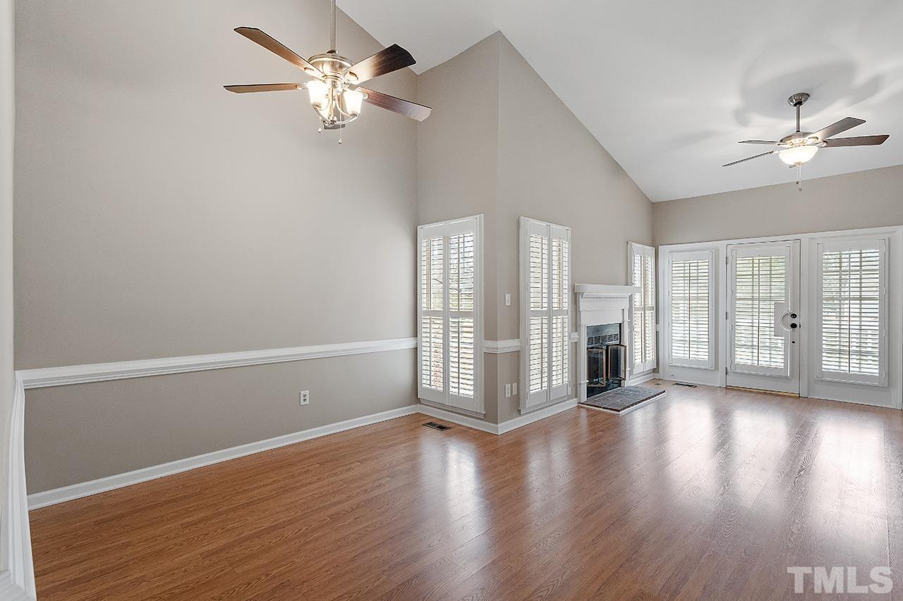 5701 Grasmere Court Raleigh, NC 27609 - Photo 20 of 34 a view of an empty room with wooden floor and a window