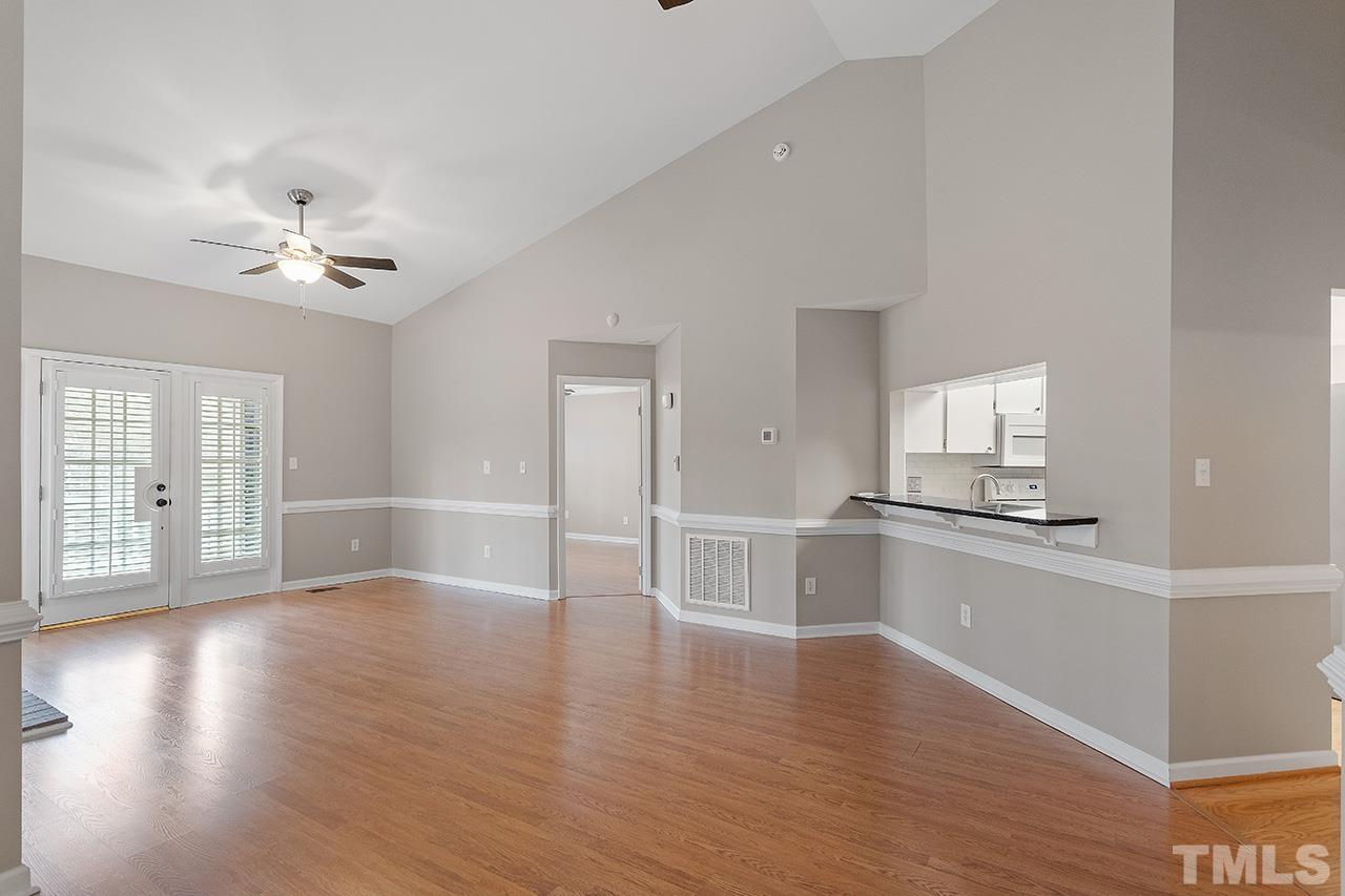 5701 Grasmere Court Raleigh, NC 27609 - Photo 21 of 34 a view of an empty room with window and wooden floor
