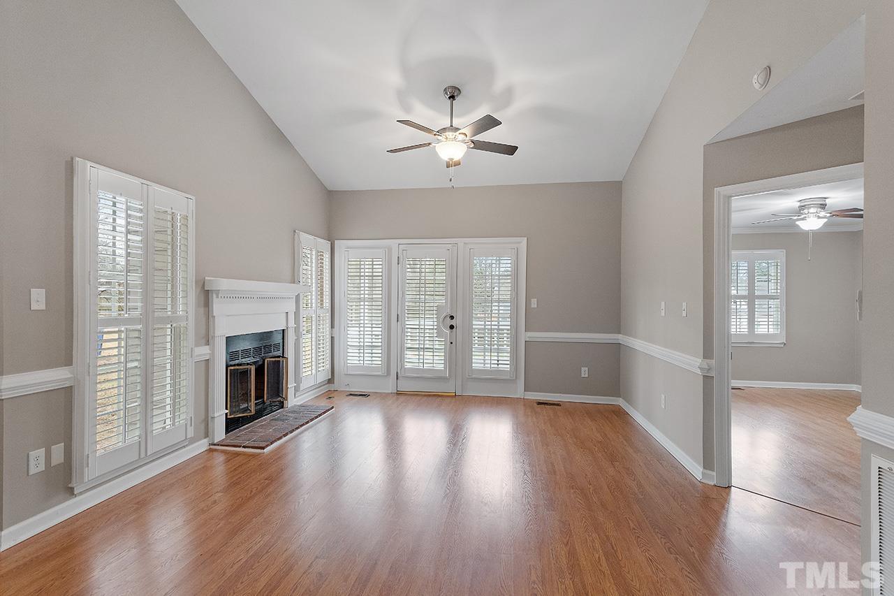 5701 Grasmere Court Raleigh, NC 27609 - Photo 23 of 34 a view of an empty room with wooden floor and a window