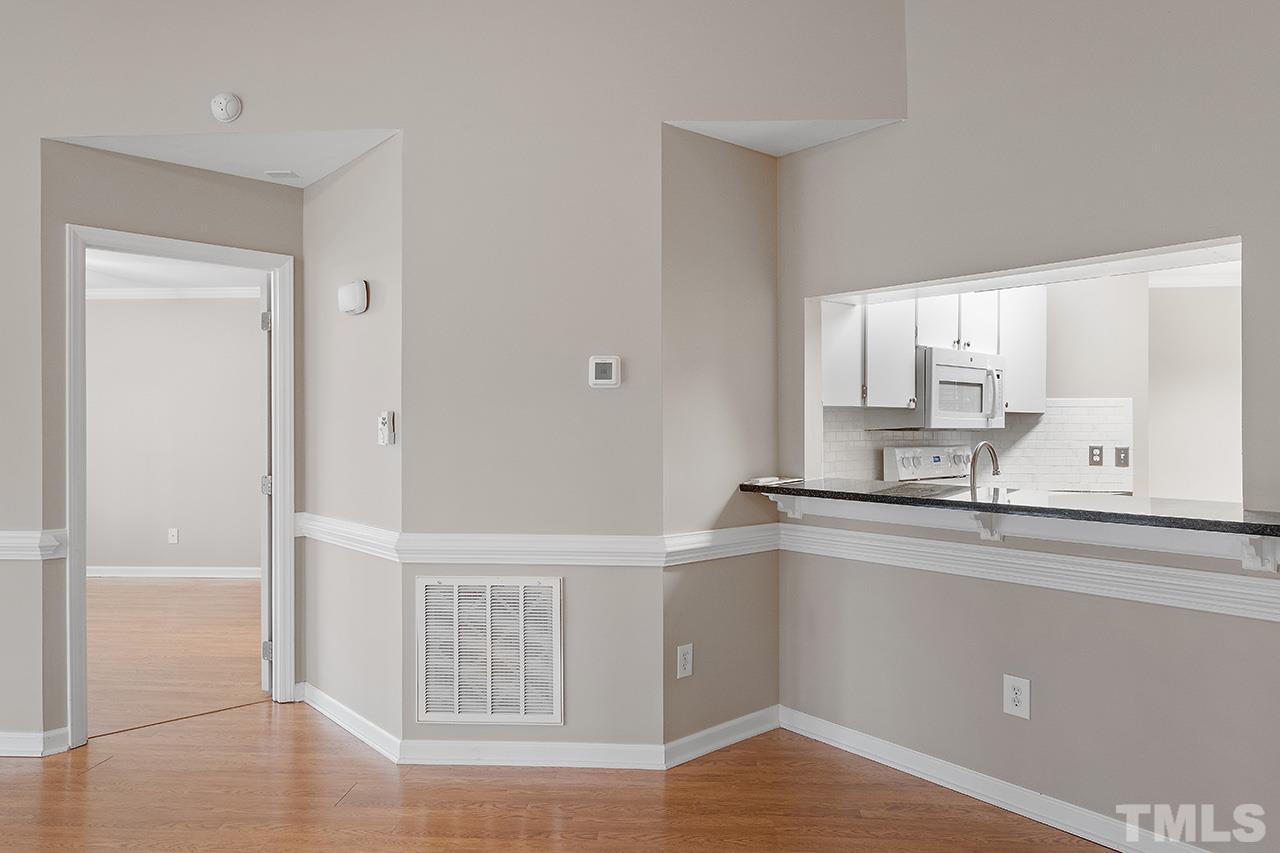 5701 Grasmere Court Raleigh, NC 27609 - Photo 26 of 34 a kitchen with a sink cabinets and window