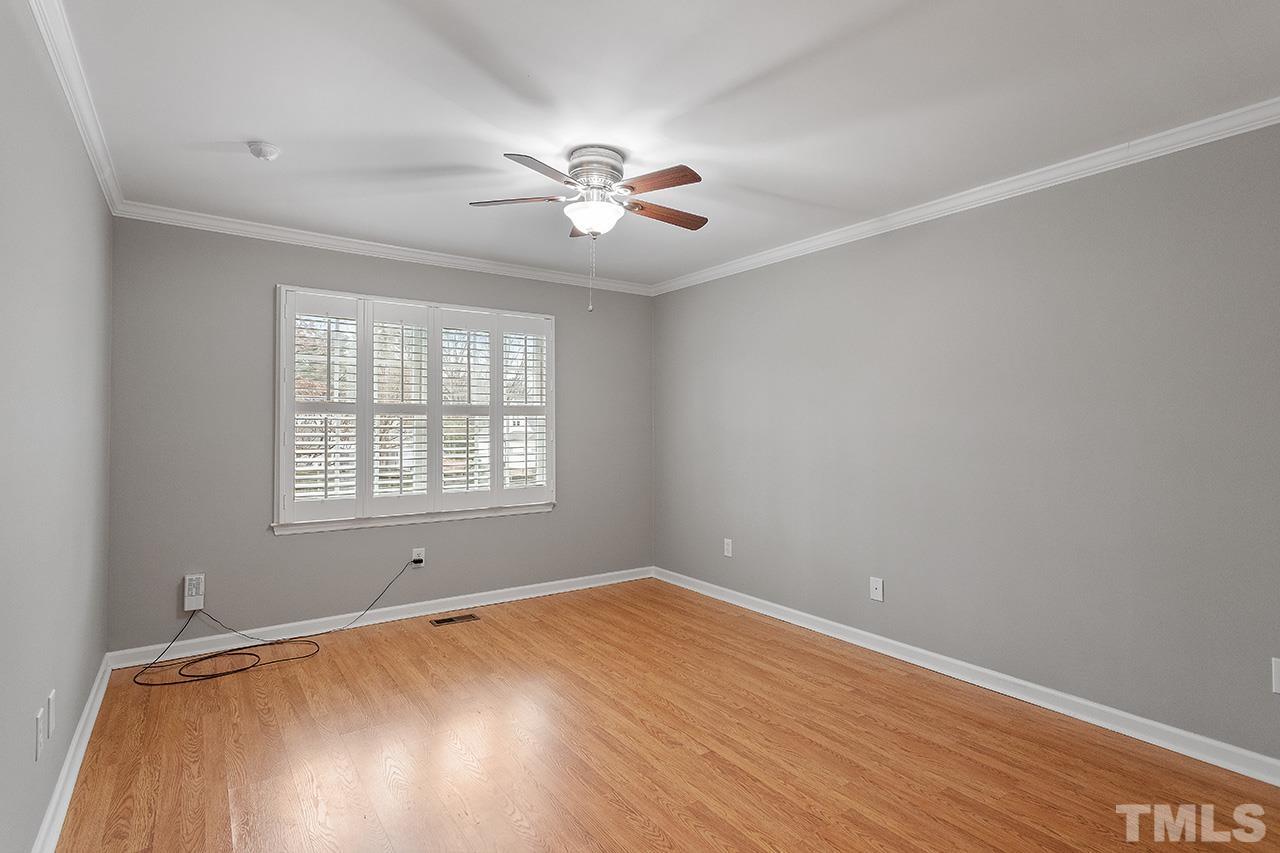 5701 Grasmere Court Raleigh, NC 27609 - Photo 30 of 34 wooden floor in an empty room with a window