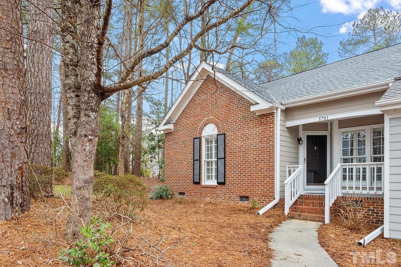 5701 Grasmere Court Raleigh, NC 27609 - Photo 3 of 34 a front view of a house with a yard