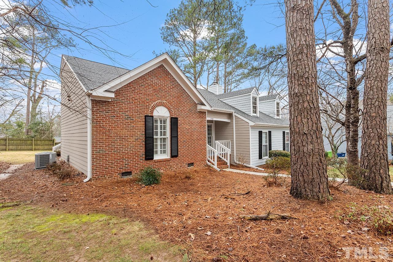 5701 Grasmere Court Raleigh, NC 27609 - Photo 4 of 34 a view of a house with a yard