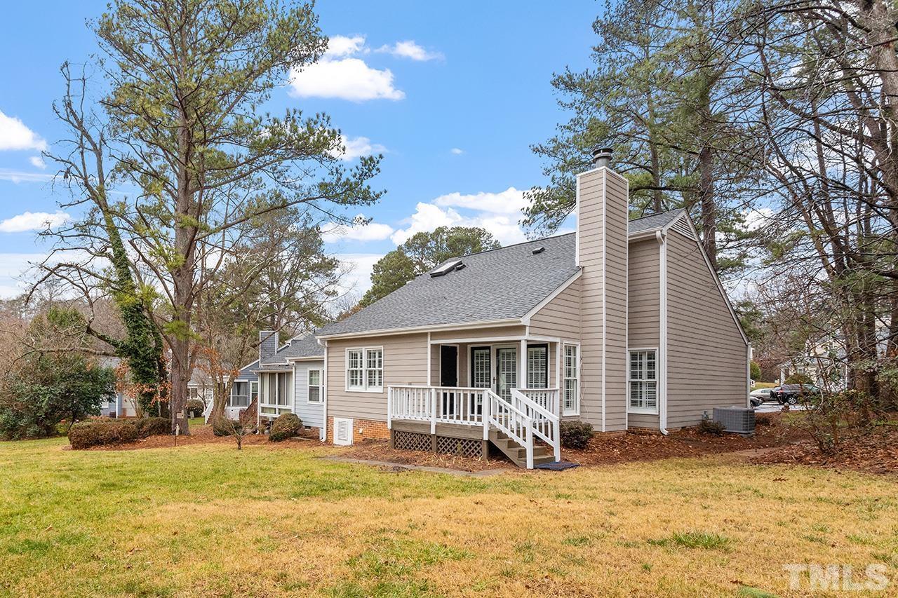 5701 Grasmere Court Raleigh, NC 27609 - Photo 5 of 34 a view of a yard in front of a house with large tree
