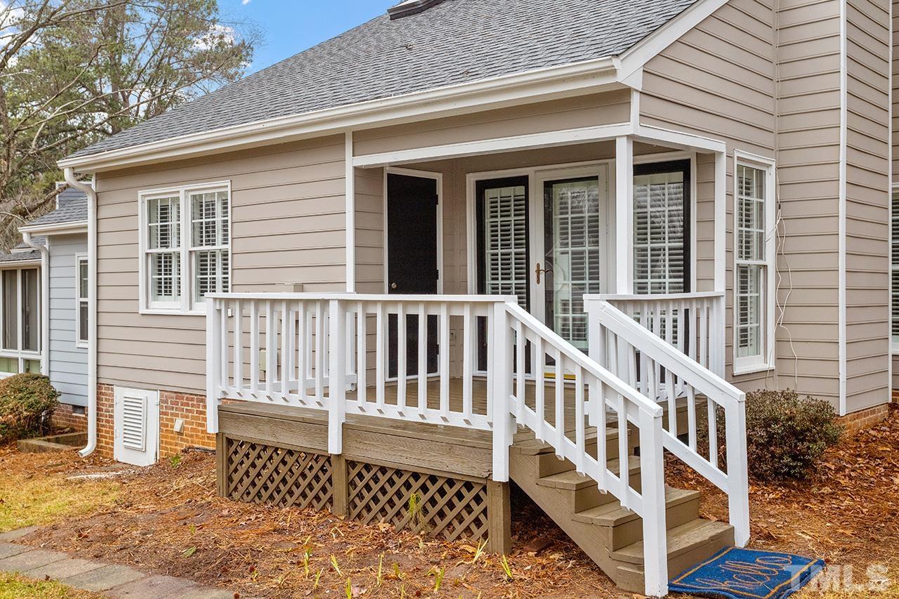 5701 Grasmere Court Raleigh, NC 27609 - Photo 6 of 34 a balcony with a bench