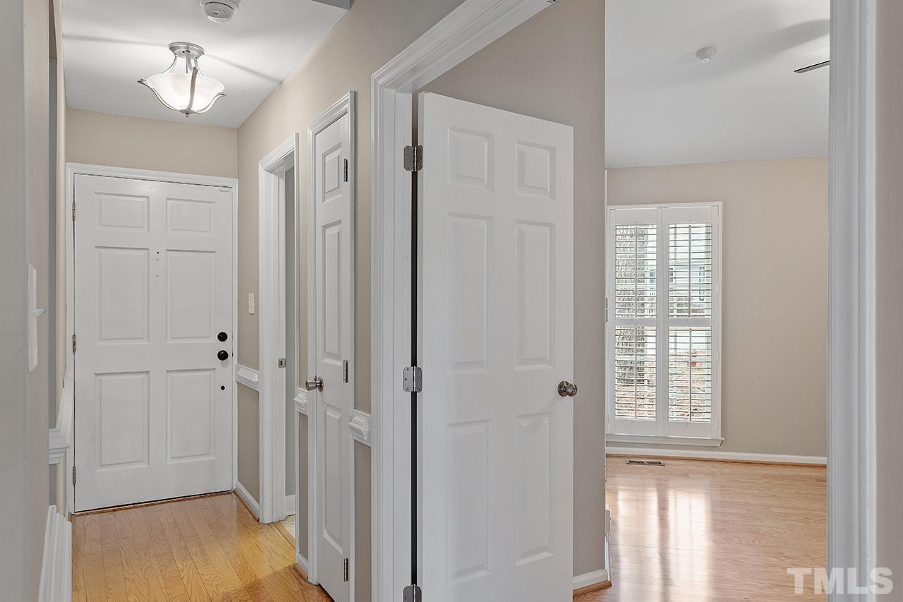 5701 Grasmere Court Raleigh, NC 27609 - Photo 7 of 34 a view of a bathroom with a shower and wooden floor