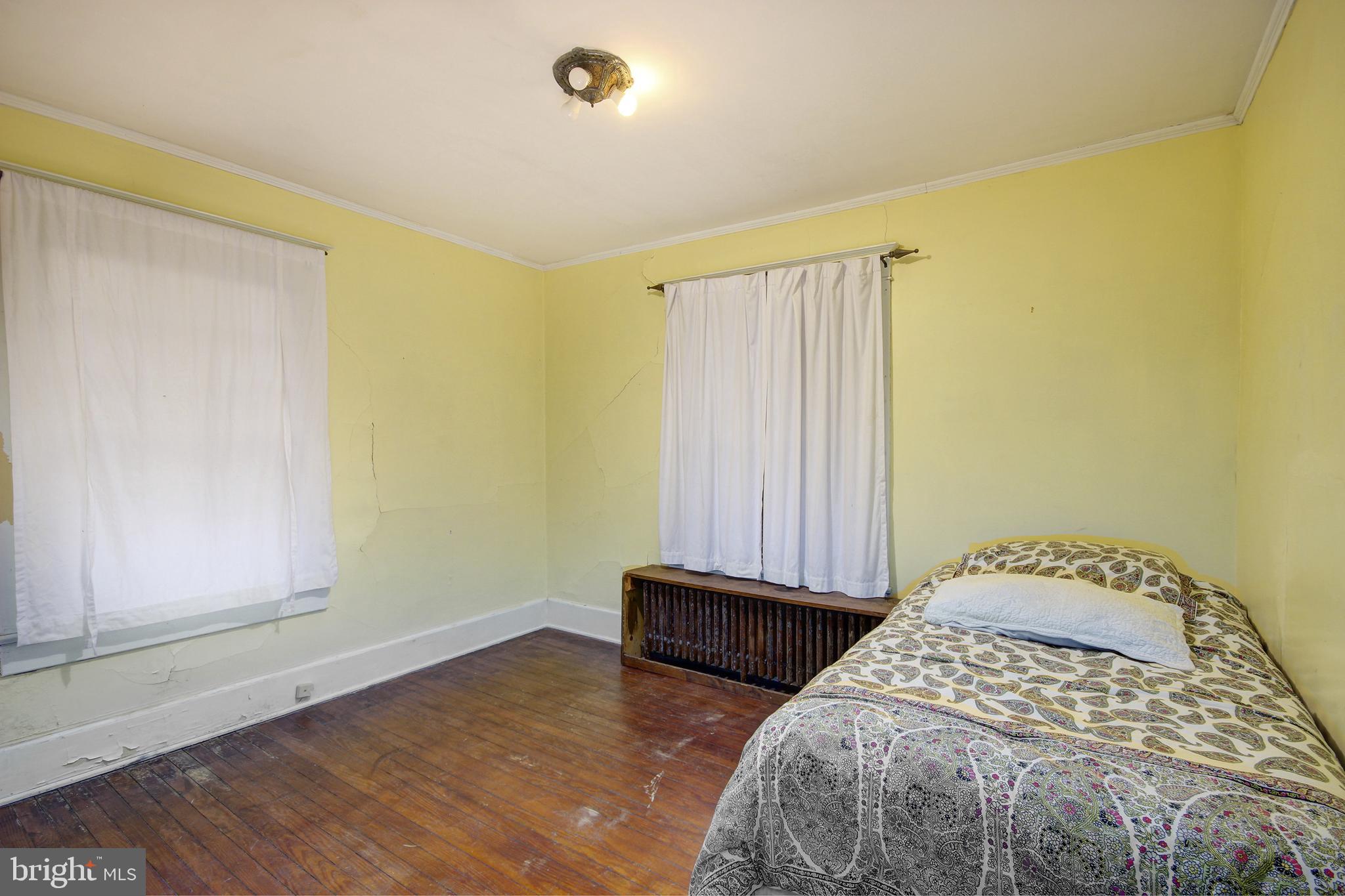 616 Camden Avenue Salisbury, MD 21801 - Photo 16 of 24 a bedroom with a bed and a window