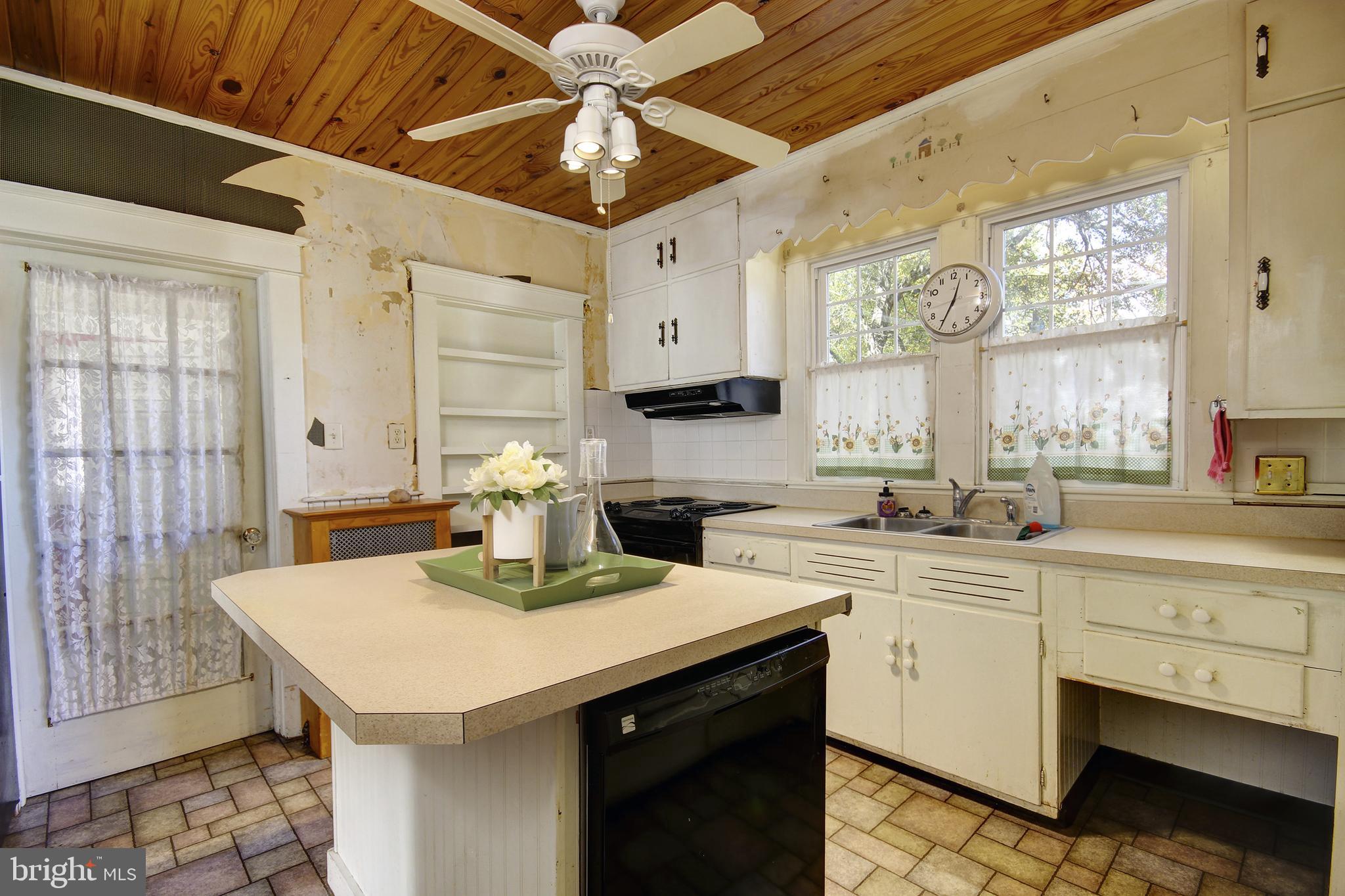 616 Camden Avenue Salisbury, MD 21801 - Photo 8 of 24 a kitchen with a sink a window and cabinets
