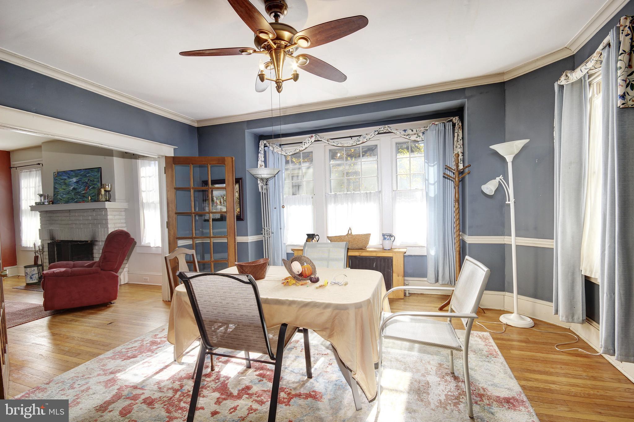 616 Camden Avenue Salisbury, MD 21801 - Photo 10 of 24 a view of a dining room with furniture window and wooden floor