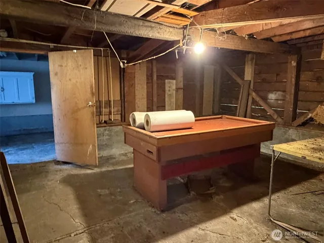 a view of an empty room with a staircase