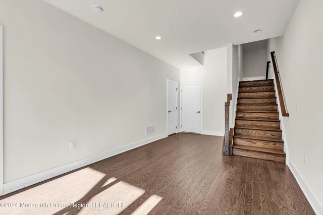 a view of entryway with wooden floor