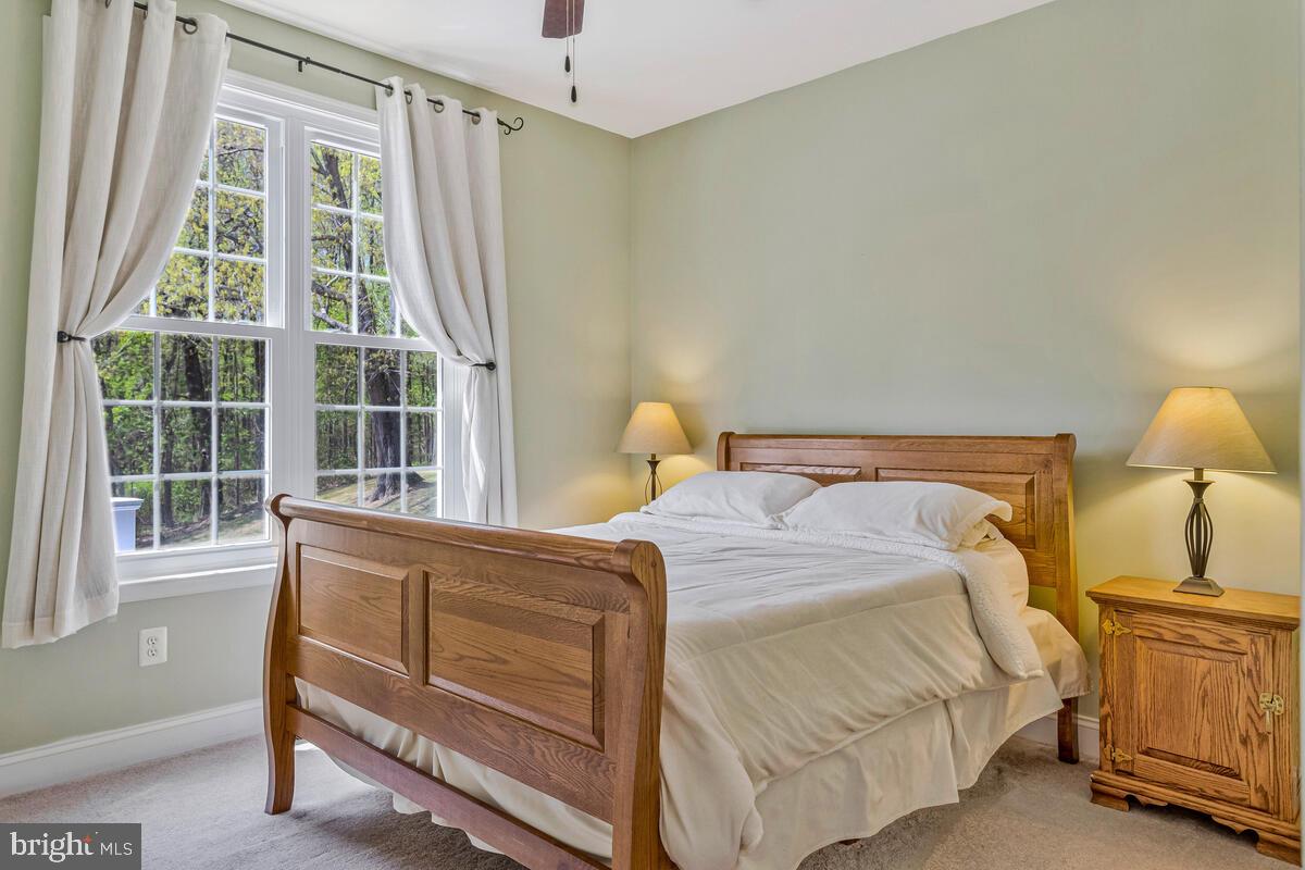 2720 Emmanuel Church Road Huntingtown, MD 20639 - Photo 29 of 85 a bedroom with a bed and a window