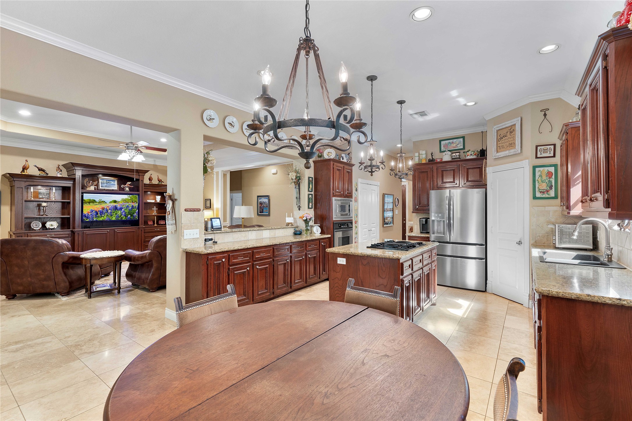 2974 Hargraves Road Huffman, TX 77336 - Photo 15 of 50 a large living room with stainless steel appliances furniture a chandelier a large kitchen view