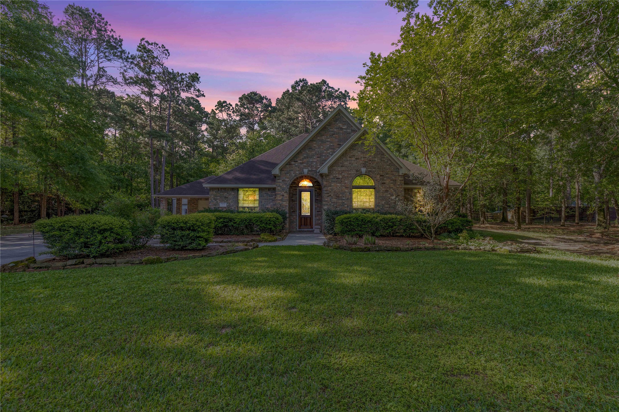 2974 Hargraves Road Huffman, TX 77336 - Photo 2 of 50 a front view of a house with a garden