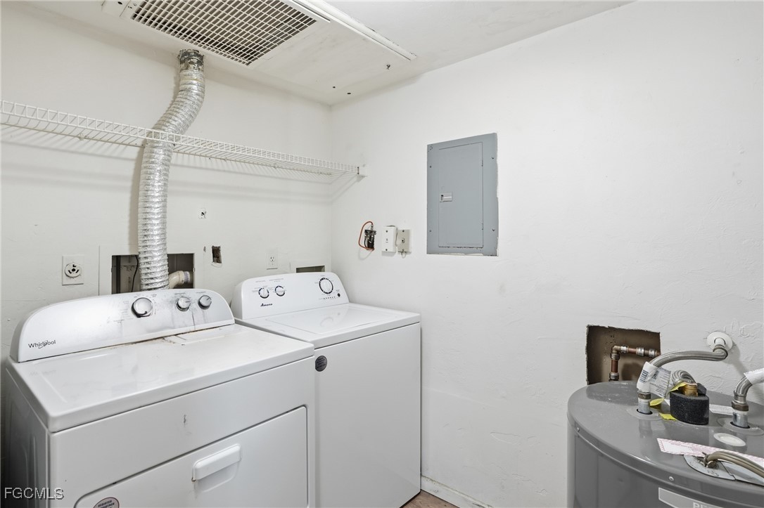 240 Pebble Beach Boulevard, Unit 712 Naples, FL 34113 - Photo 11 of 22 a utility room with dryer and washer