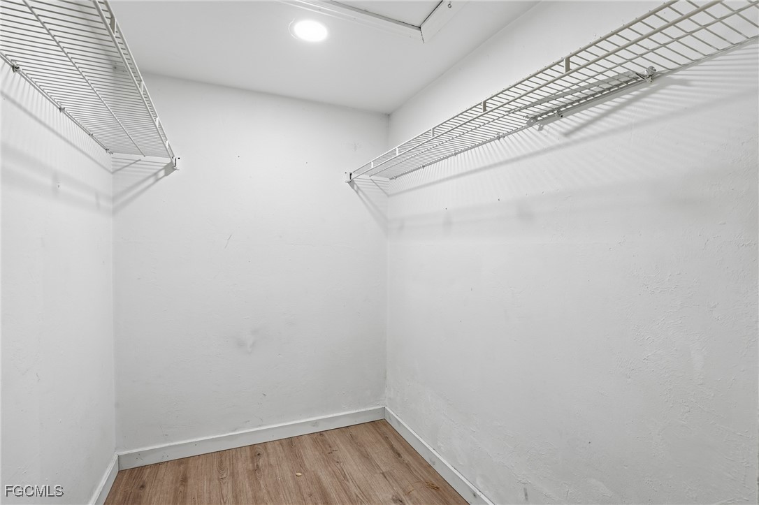 240 Pebble Beach Boulevard, Unit 712 Naples, FL 34113 - Photo 14 of 22 a view of small space with racks on the wall