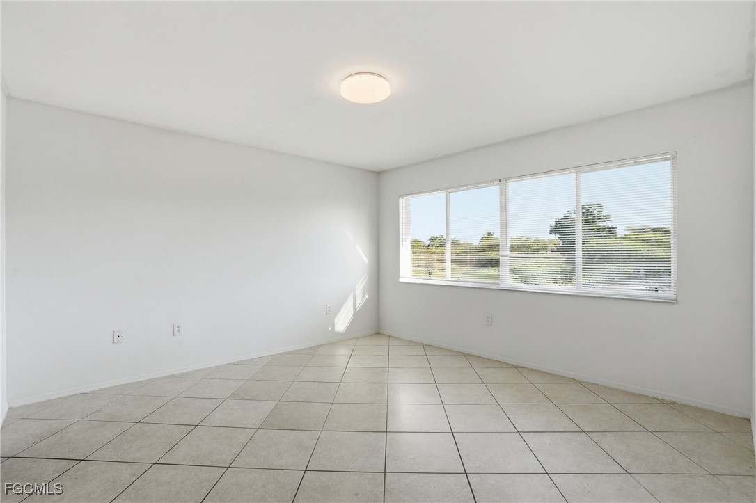 240 Pebble Beach Boulevard, Unit 712 Naples, FL 34113 - Photo 16 of 22 an empty room with windows