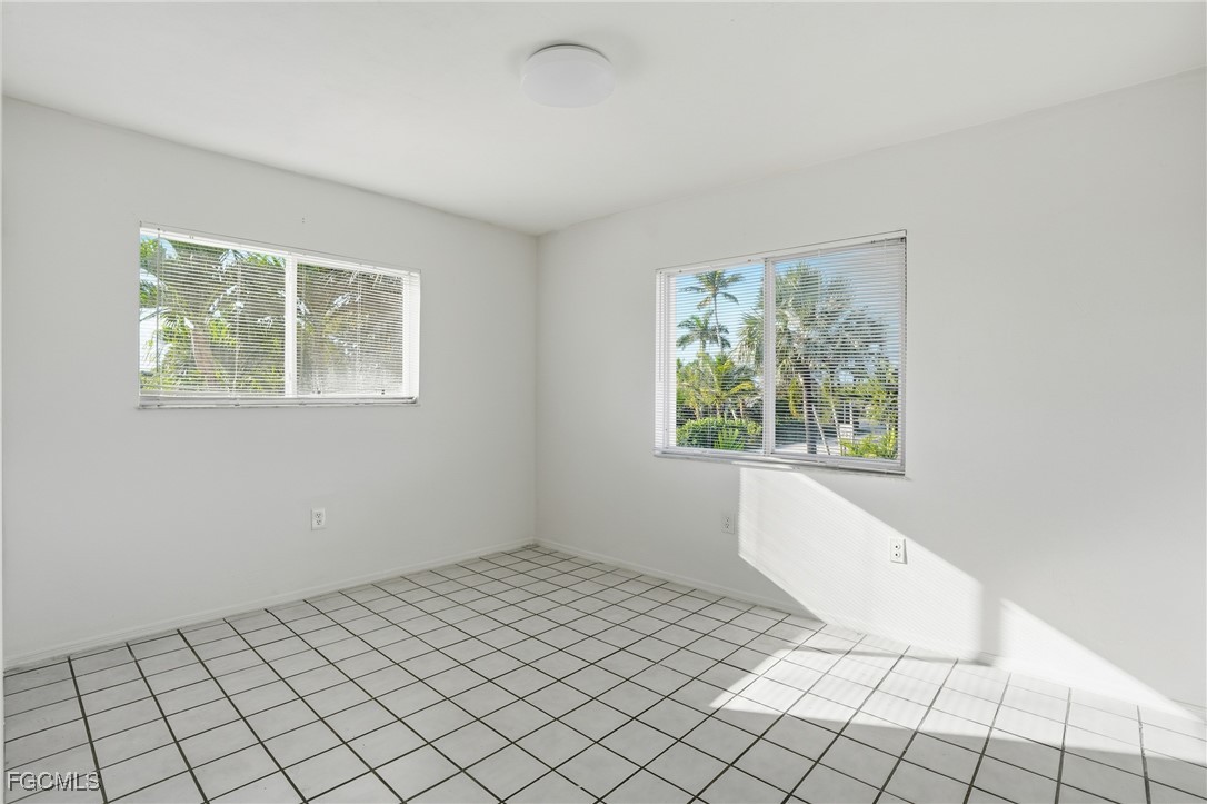 240 Pebble Beach Boulevard, Unit 712 Naples, FL 34113 - Photo 17 of 22 a view of an empty room with window