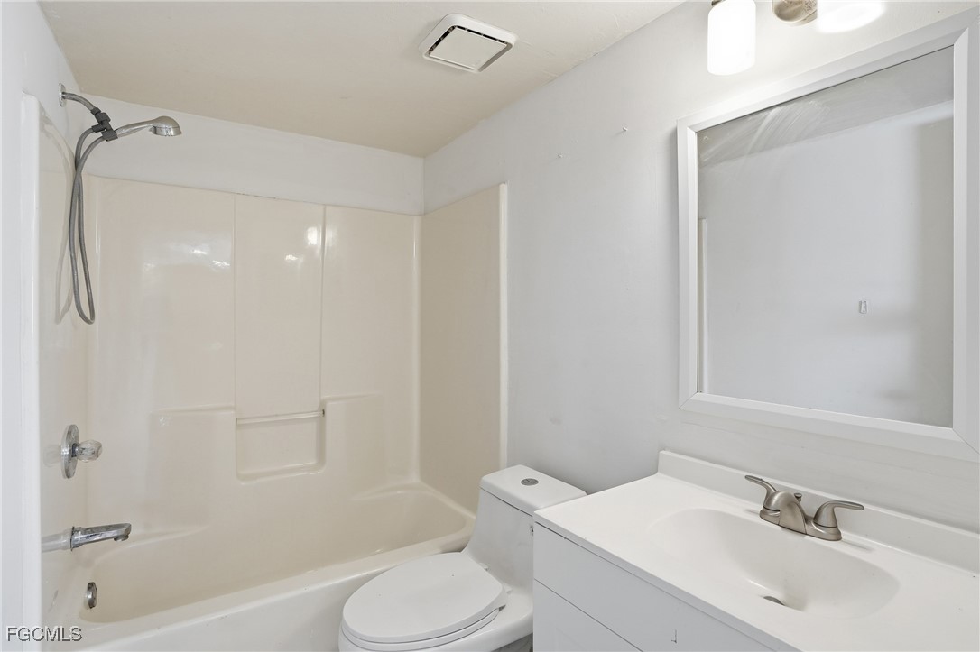 240 Pebble Beach Boulevard, Unit 712 Naples, FL 34113 - Photo 19 of 22 a bathroom with a sink toilet and shower