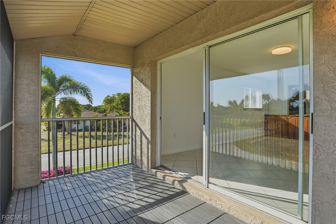 240 Pebble Beach Boulevard, Unit 712 Naples, FL 34113 - Photo 21 of 22 a view of a bathroom with a glass door