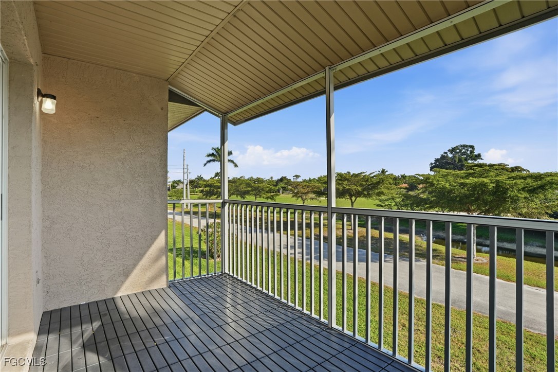 240 Pebble Beach Boulevard, Unit 712 Naples, FL 34113 - Photo 22 of 22 a view of balcony with wooden floor