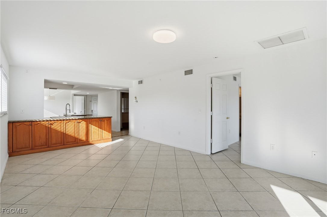 240 Pebble Beach Boulevard, Unit 712 Naples, FL 34113 - Photo 7 of 22 a view of an empty room