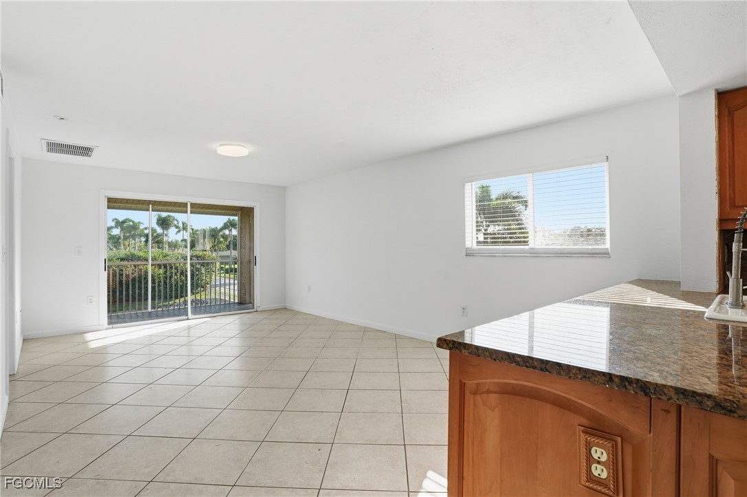 240 Pebble Beach Boulevard, Unit 712 Naples, FL 34113 - Photo 8 of 22 a view of kitchen and window