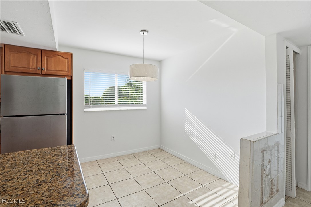 240 Pebble Beach Boulevard, Unit 712 Naples, FL 34113 - Photo 10 of 22 a view of an empty room with a window