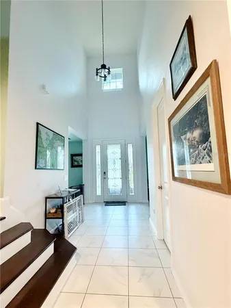 a view of a livingroom with furniture and windows