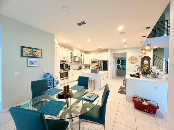 a living room with furniture and kitchen view