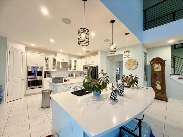 a kitchen with a dining table and chairs