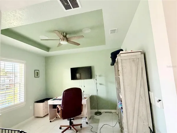 a work room with furniture and a window