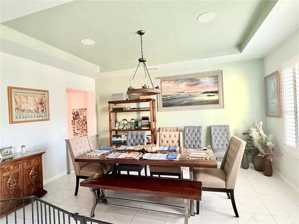 a living room with furniture a rug and a window