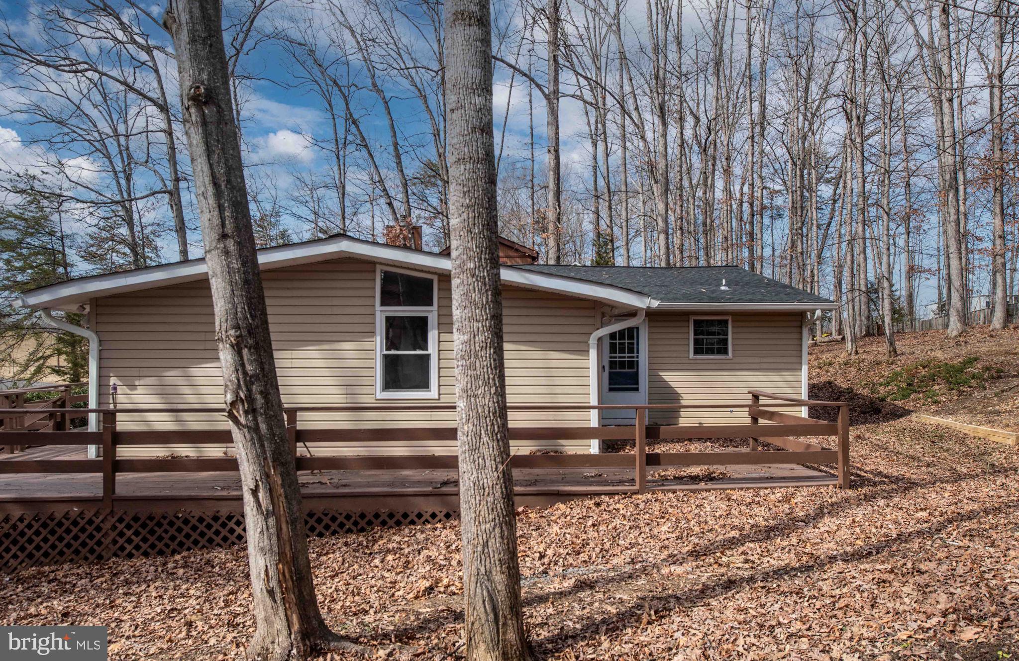 116 Lakeview Parkway Locust Grove, VA 22508 - Photo 1 of 71 a view of a house with backyard and trees