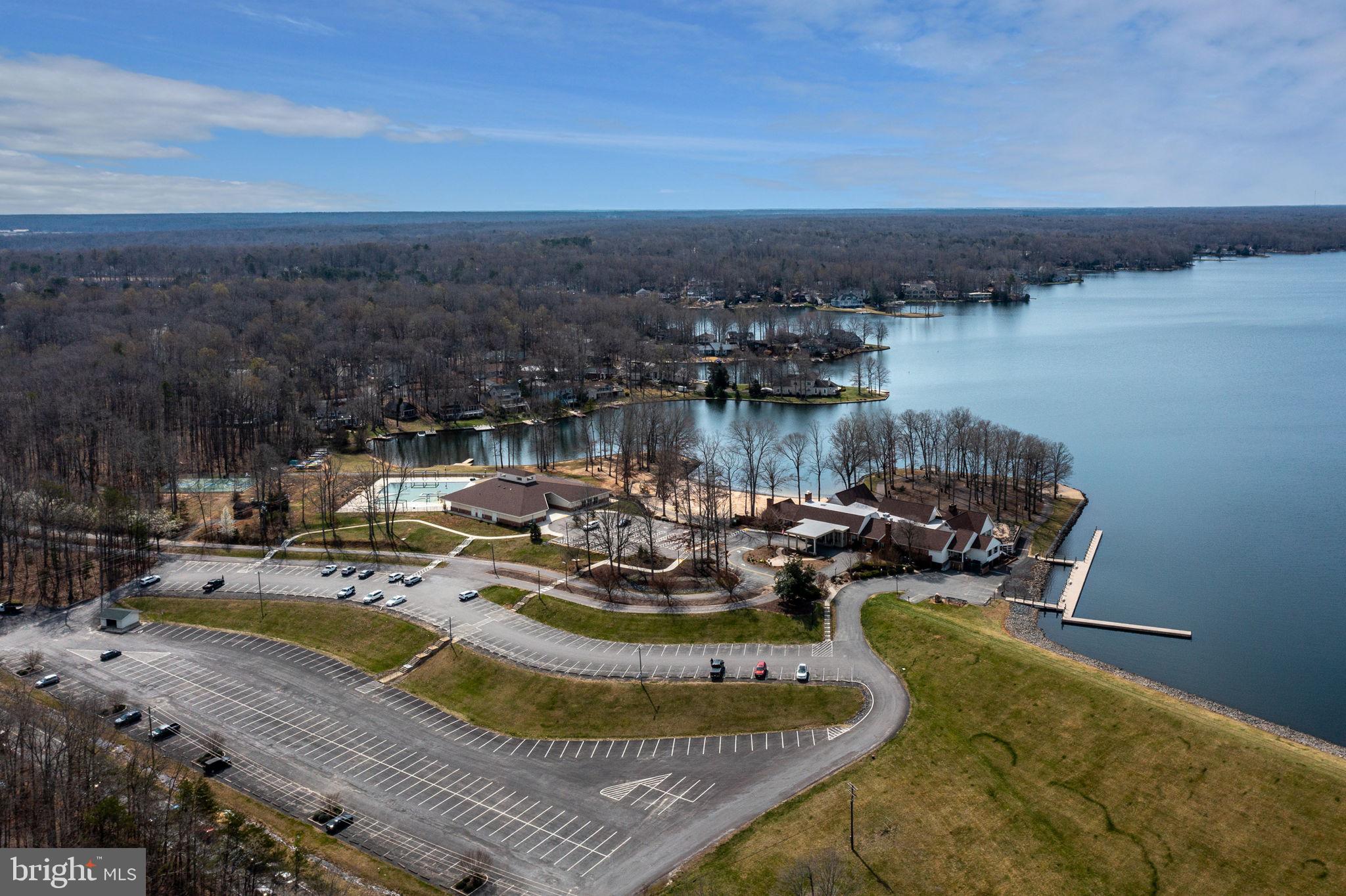 116 Lakeview Parkway Locust Grove, VA 22508 - Photo 64 of 71 a view of a lake with couches chairs and a table and chairs