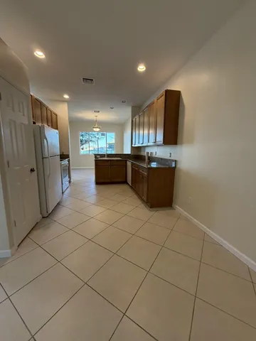 a kitchen with stainless steel appliances a refrigerator and a sink