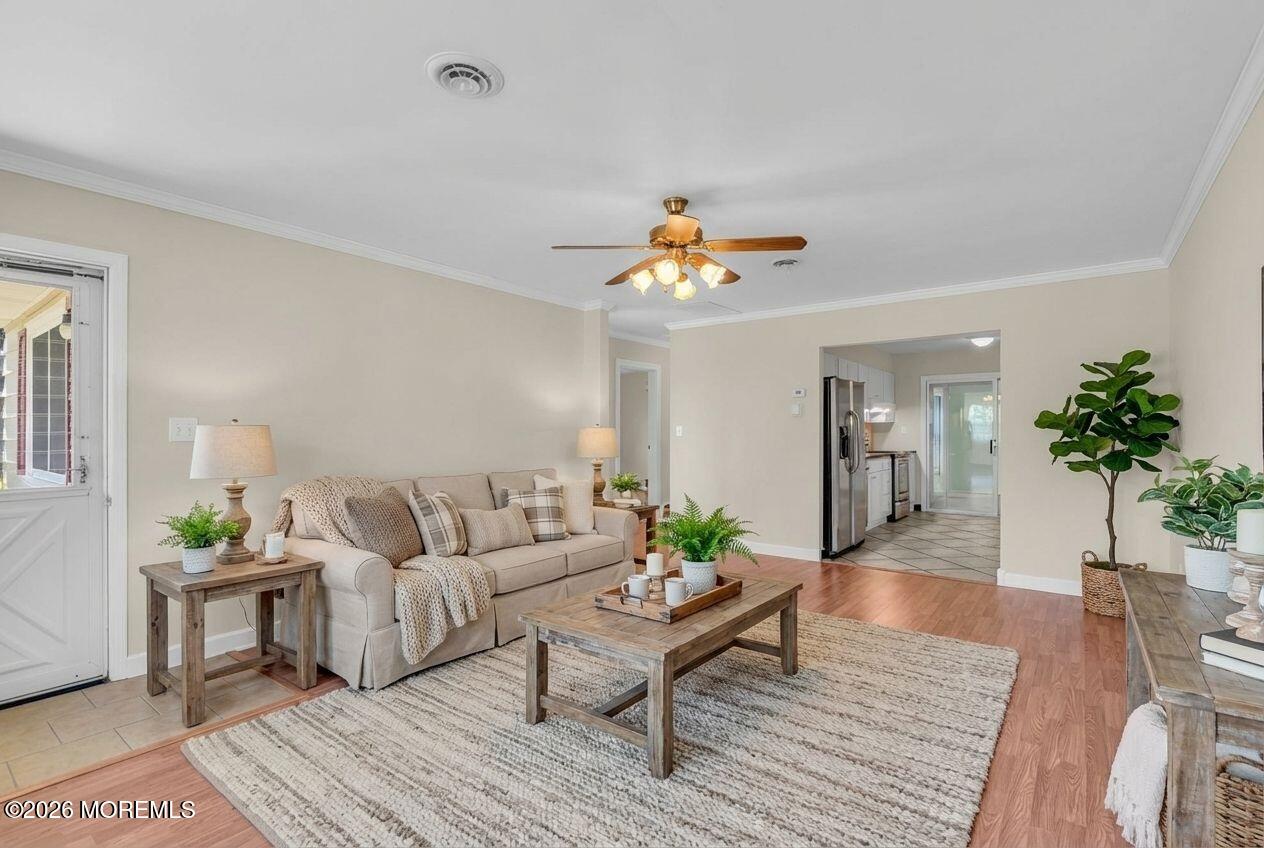 11 Vermont Way Whiting, NJ 08759 - Photo 3 of 14 a living room with furniture and a chandelier