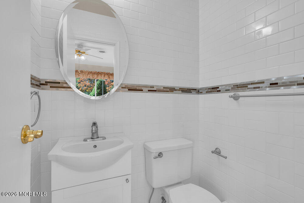 11 Vermont Way Whiting, NJ 08759 - Photo 6 of 14 a bathroom with a toilet a sink and mirror