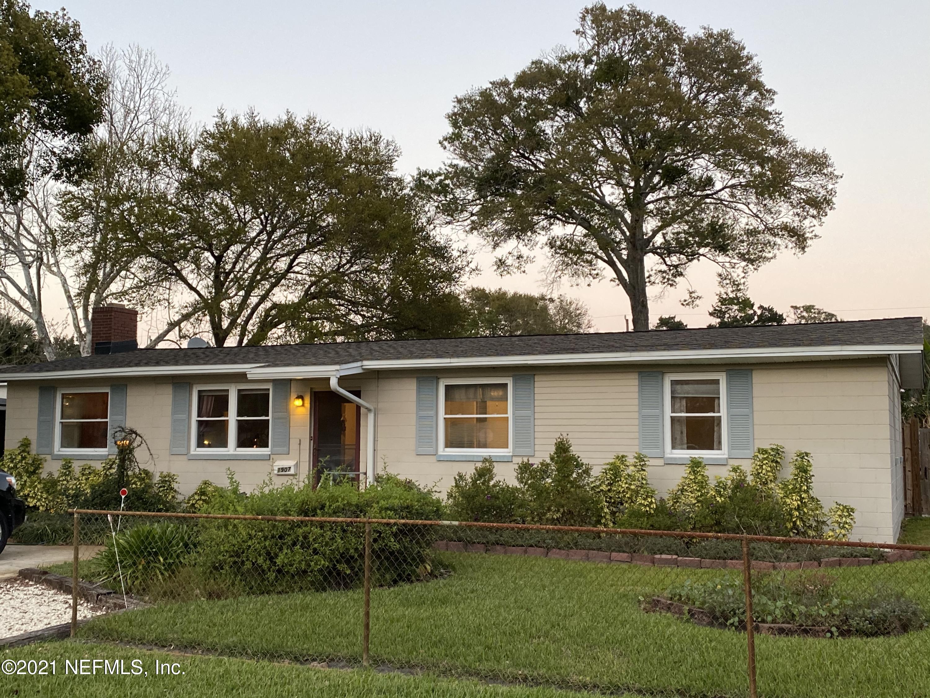 1907 Penman Road Jacksonville Beach, FL 32250 - Photo 1 of 25 a front view of a house with a garden
