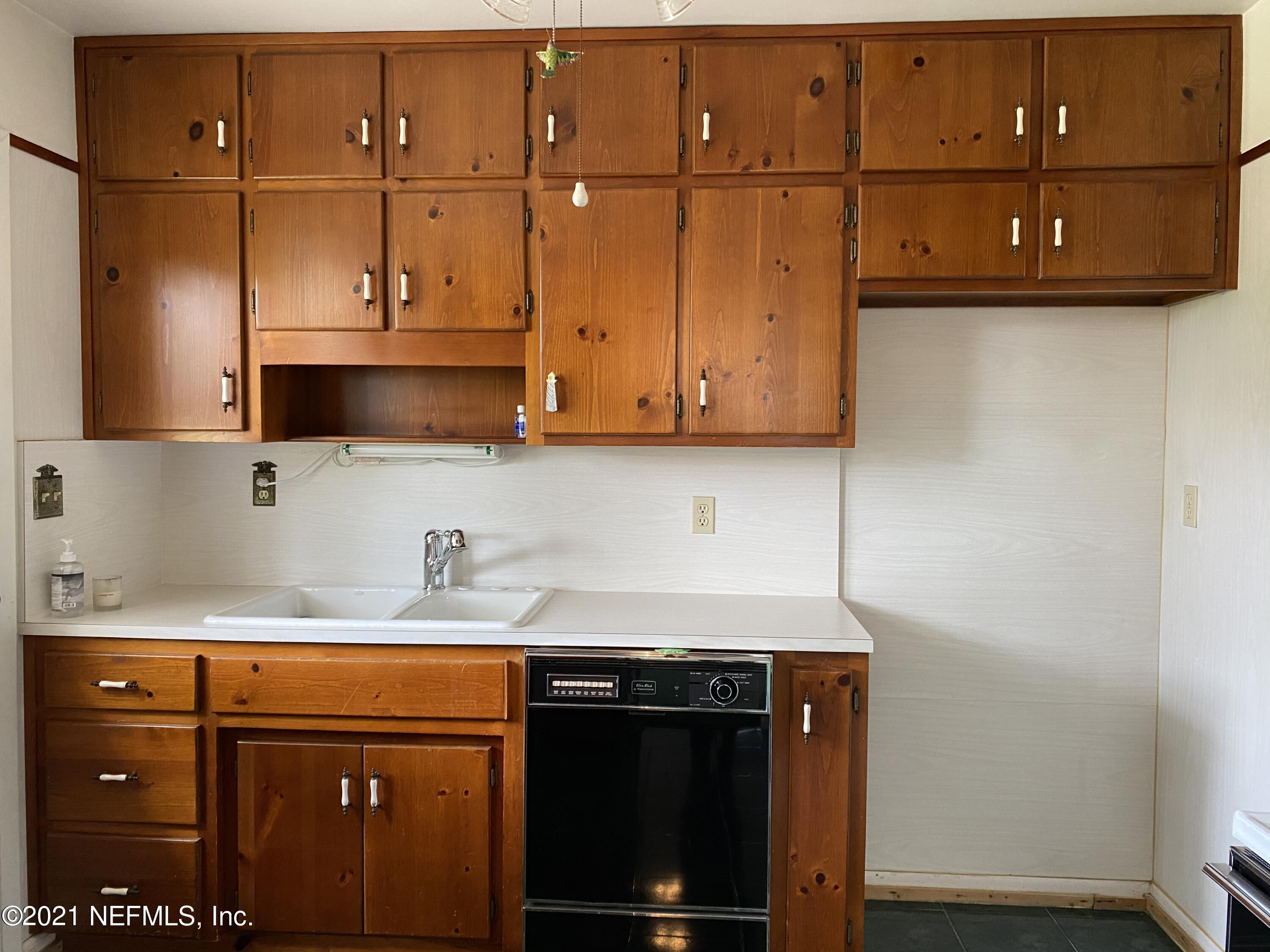 1907 Penman Road Jacksonville Beach, FL 32250 - Photo 11 of 25 a kitchen with a sink and cabinets