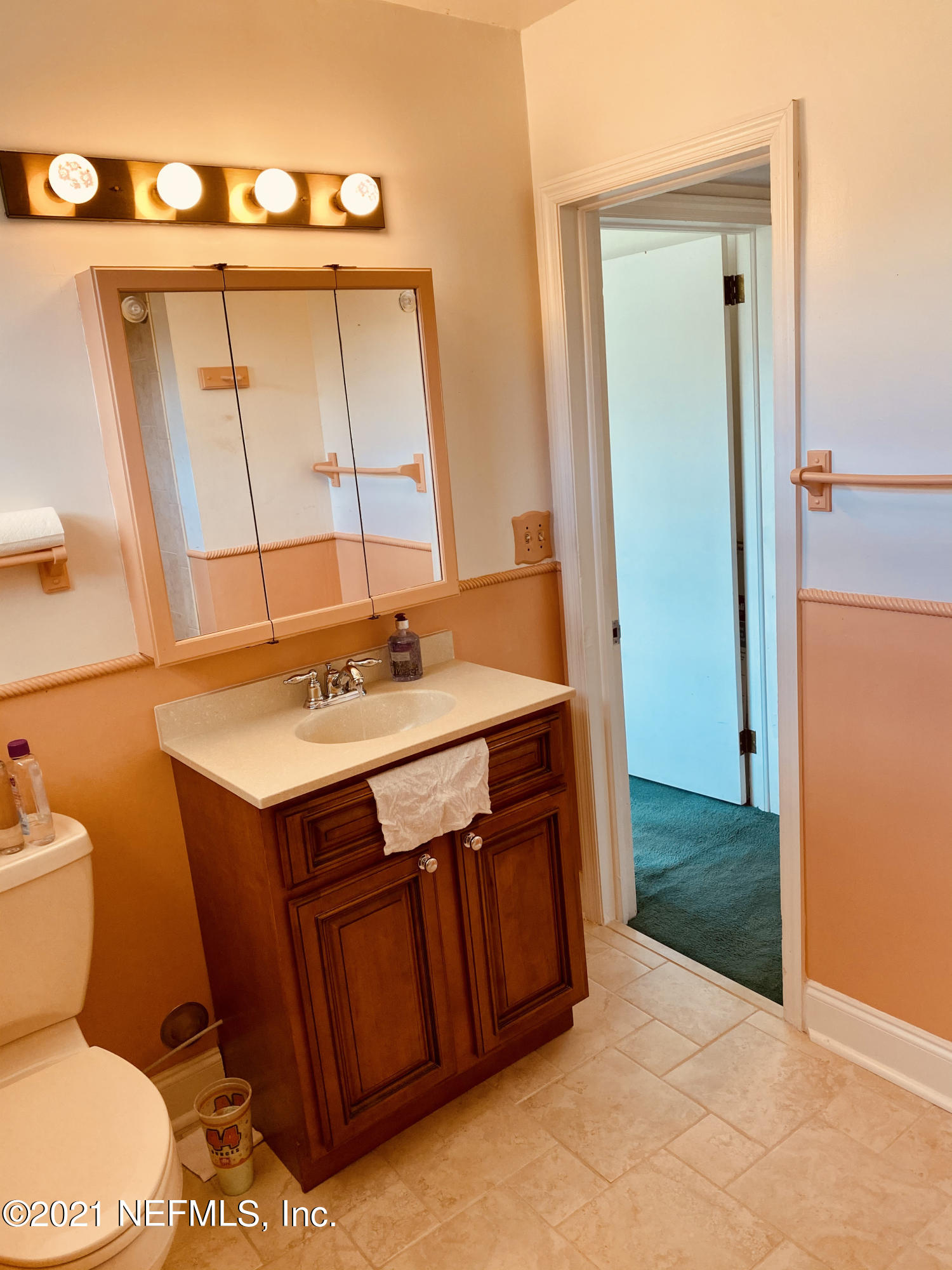 1907 Penman Road Jacksonville Beach, FL 32250 - Photo 17 of 25 a bathroom with a sink toilet and shower