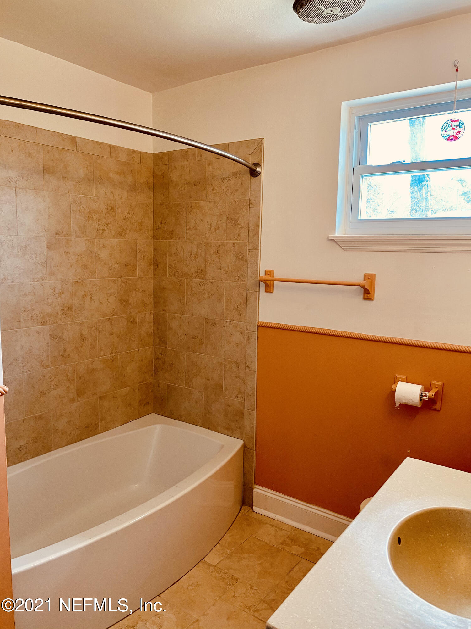 1907 Penman Road Jacksonville Beach, FL 32250 - Photo 18 of 25 a bathroom with a shower and a bath tub