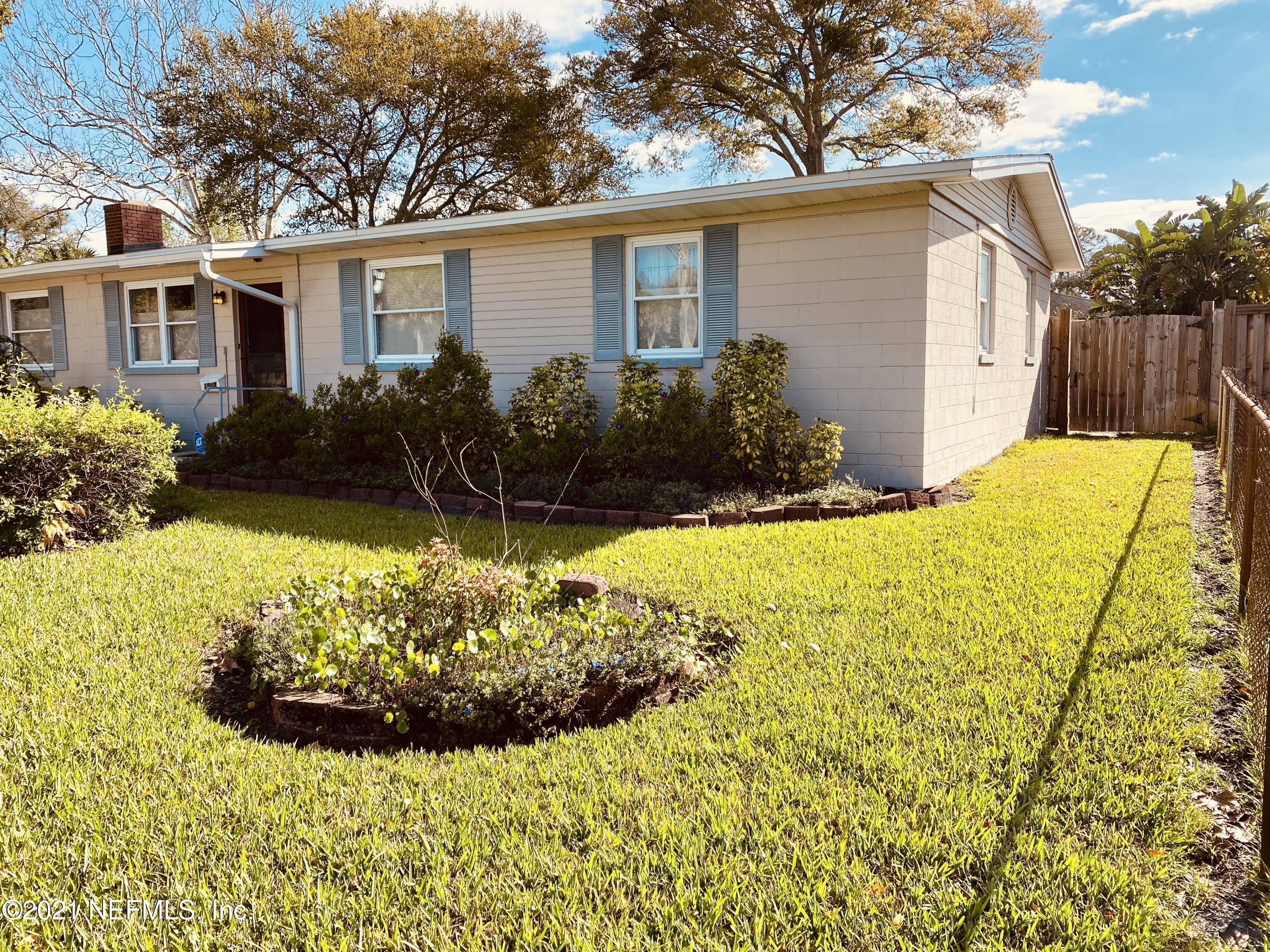 1907 Penman Road Jacksonville Beach, FL 32250 - Photo 2 of 25 a view of a backyard with plants and large tree