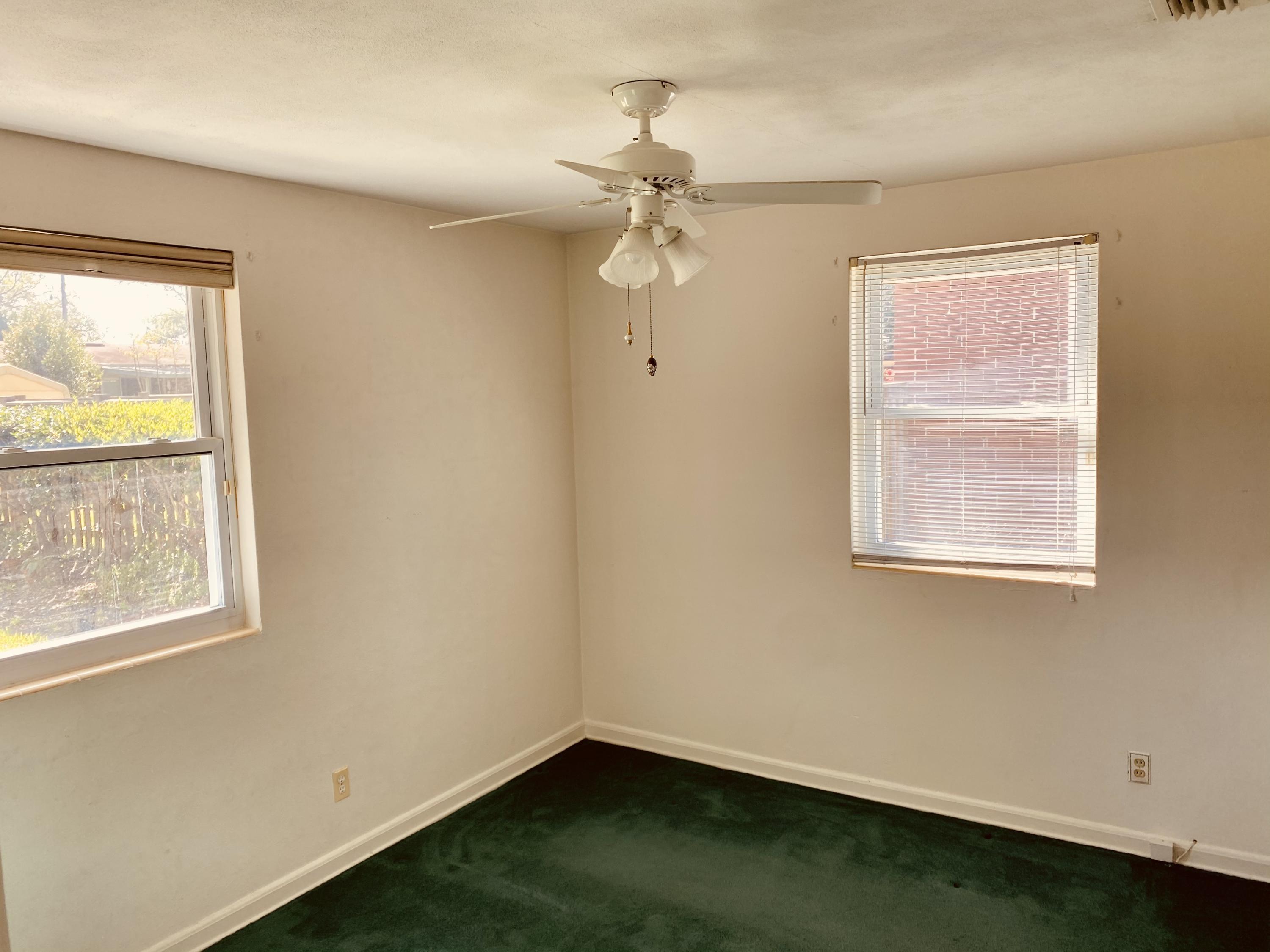 1907 Penman Road Jacksonville Beach, FL 32250 - Photo 21 of 25 a small space with a window and a ceiling fan