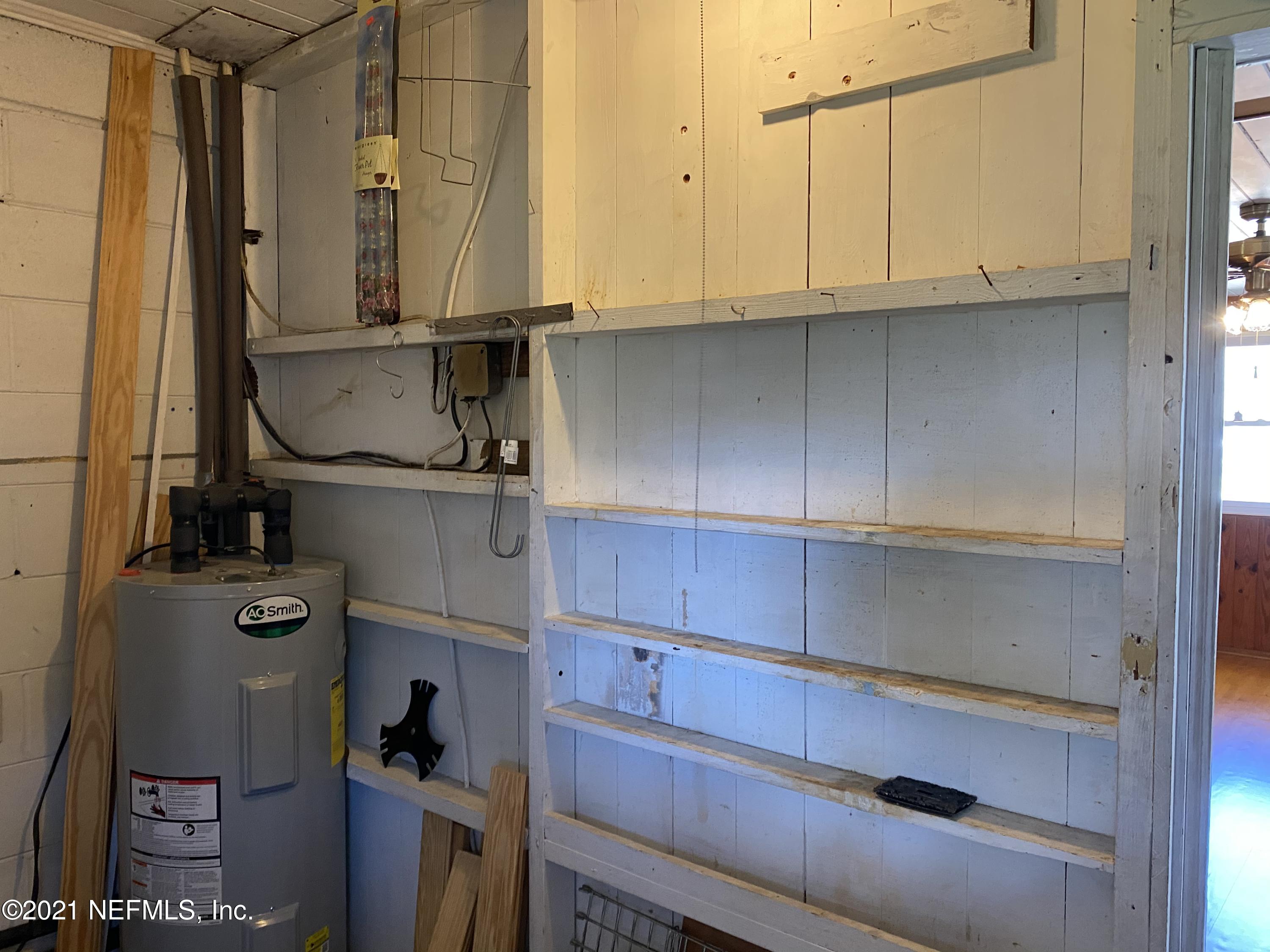 1907 Penman Road Jacksonville Beach, FL 32250 - Photo 23 of 25 a view of storage and utility room with cabinets