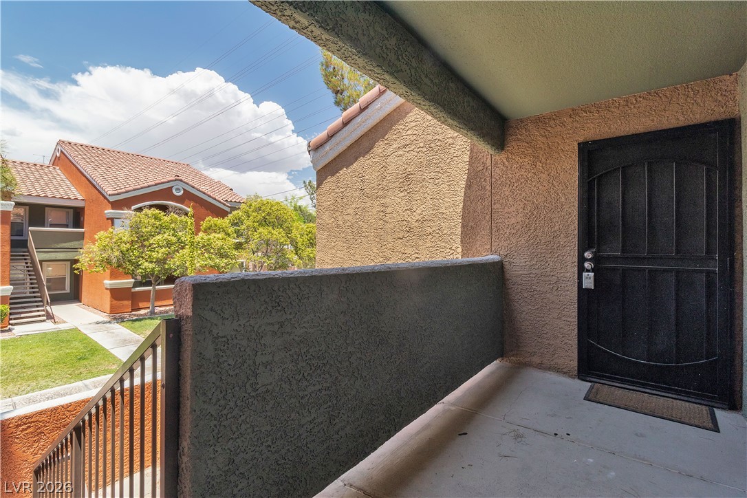 8101 West Flamingo Road, Unit 2001 Las Vegas, NV 89147 - Photo 4 of 28 A private entry patio invites with a view of neighboring architecture and verdant landscaping.