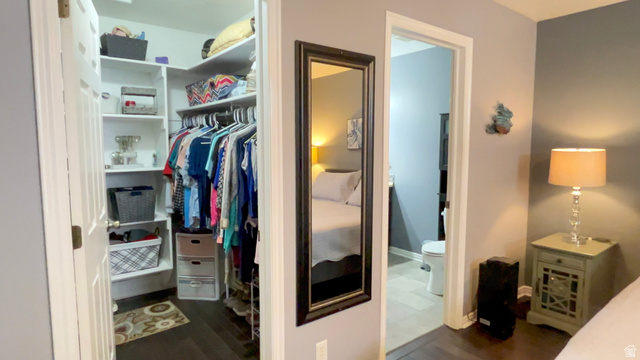 1797 Sunset Road Enoch, UT 84721 - Photo 24 of 80 Walk-in closet with built-in shelving and hanging rods