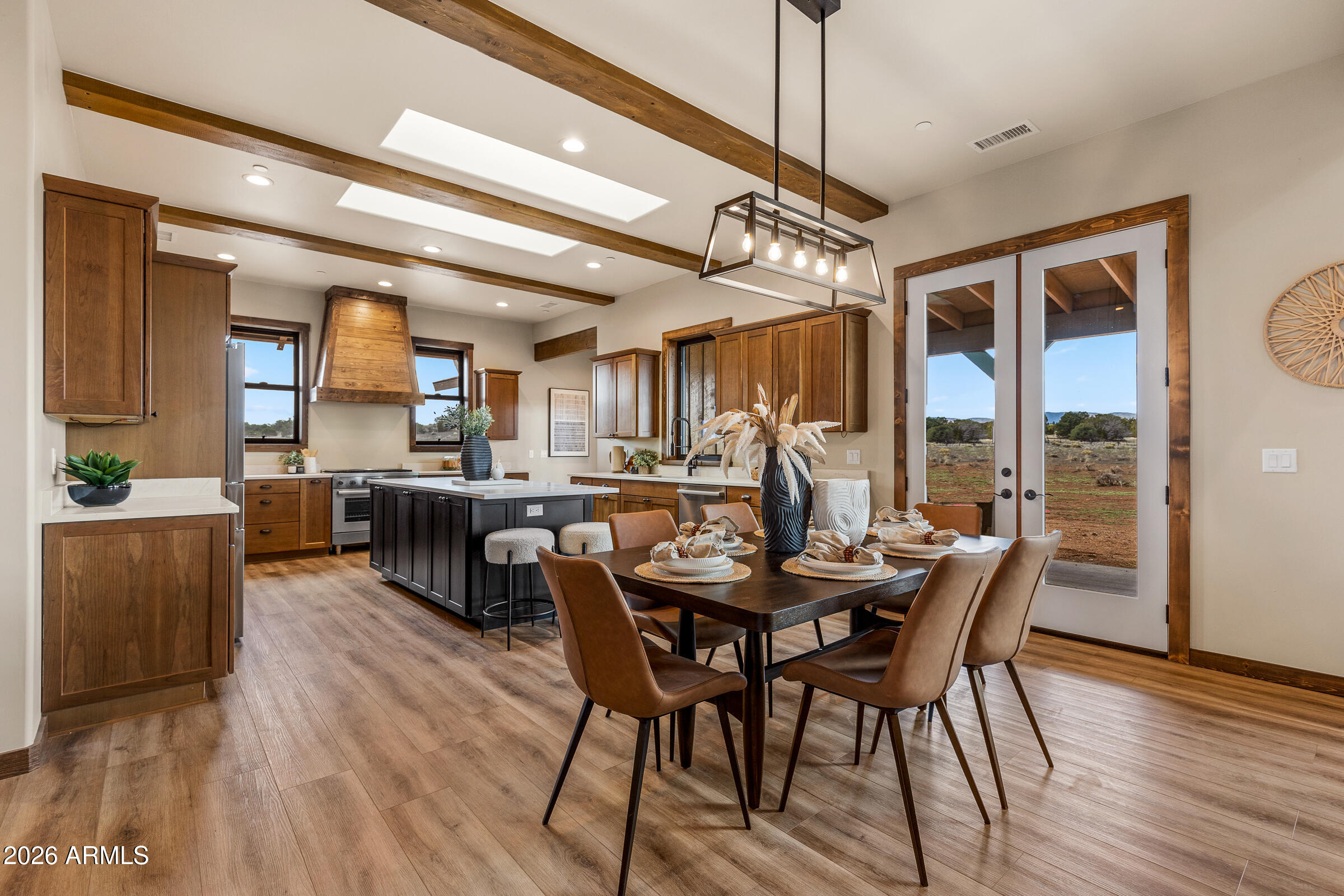 6570 Meadows Lane Flagstaff, AZ 86004 - Photo 13 of 66 a view of a dining room with furniture and wooden floor